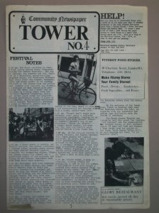 Front cover of newspaper with picture of woman on bicycle.
