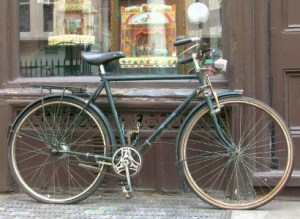 Bicycle outside shop.
