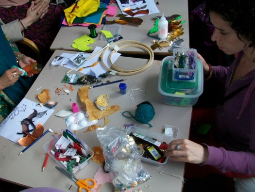 An art tutor selects materials.