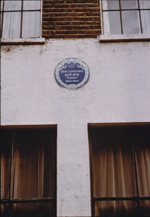Blue plaque on wall.