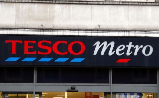 Tesco shop branding on front of store.