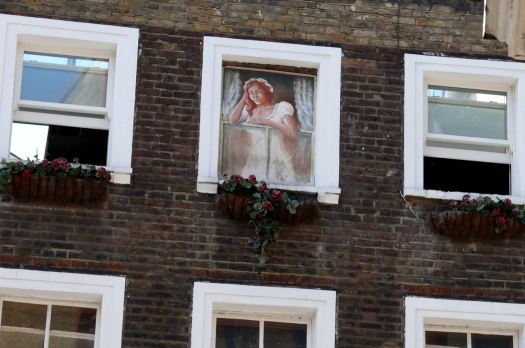 Lady of the night at window.